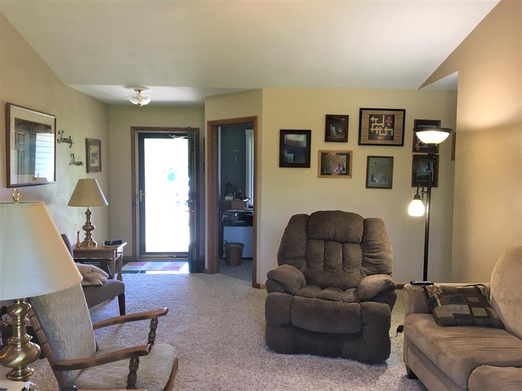 23273 Fry Road Venango, PA 16440 - Photo 41 of 74 a living room with furniture and a potted plant