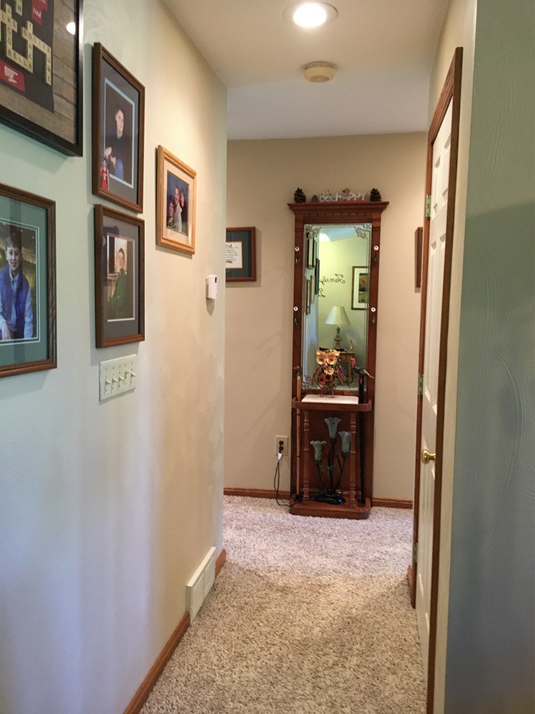 23273 Fry Road Venango, PA 16440 - Photo 42 of 74 a view of a hallway to a livingroom with furniture