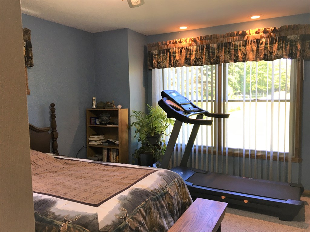 23273 Fry Road Venango, PA 16440 - Photo 43 of 74 a bed sitting in a bedroom next to a window