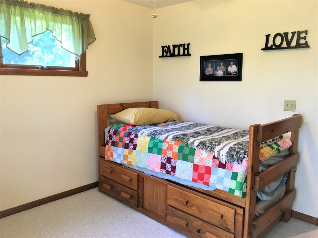 23273 Fry Road Venango, PA 16440 - Photo 47 of 74 a bedroom with a bed window and wall painting