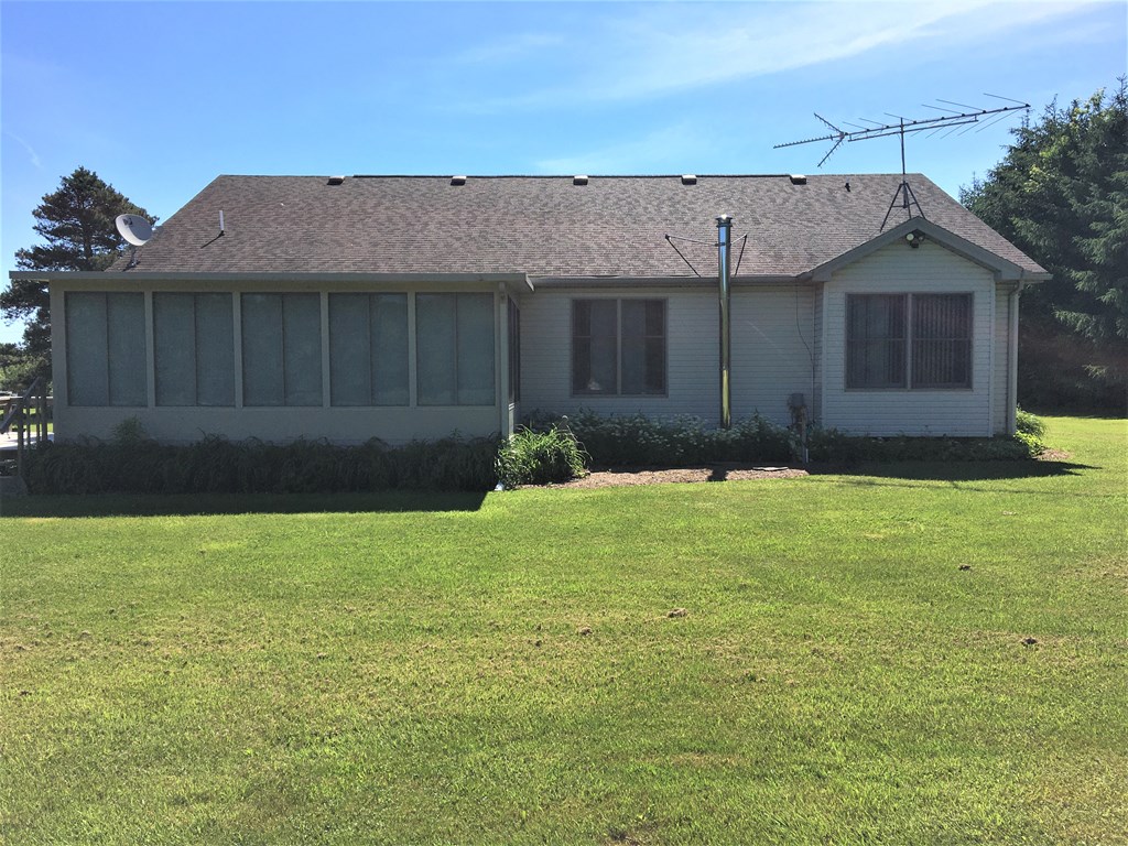 23273 Fry Road Venango, PA 16440 - Photo 5 of 74 a front view of a house with garden