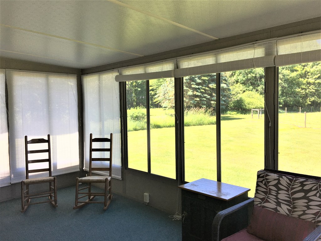 23273 Fry Road Venango, PA 16440 - Photo 57 of 74 a living room with furniture and large windows
