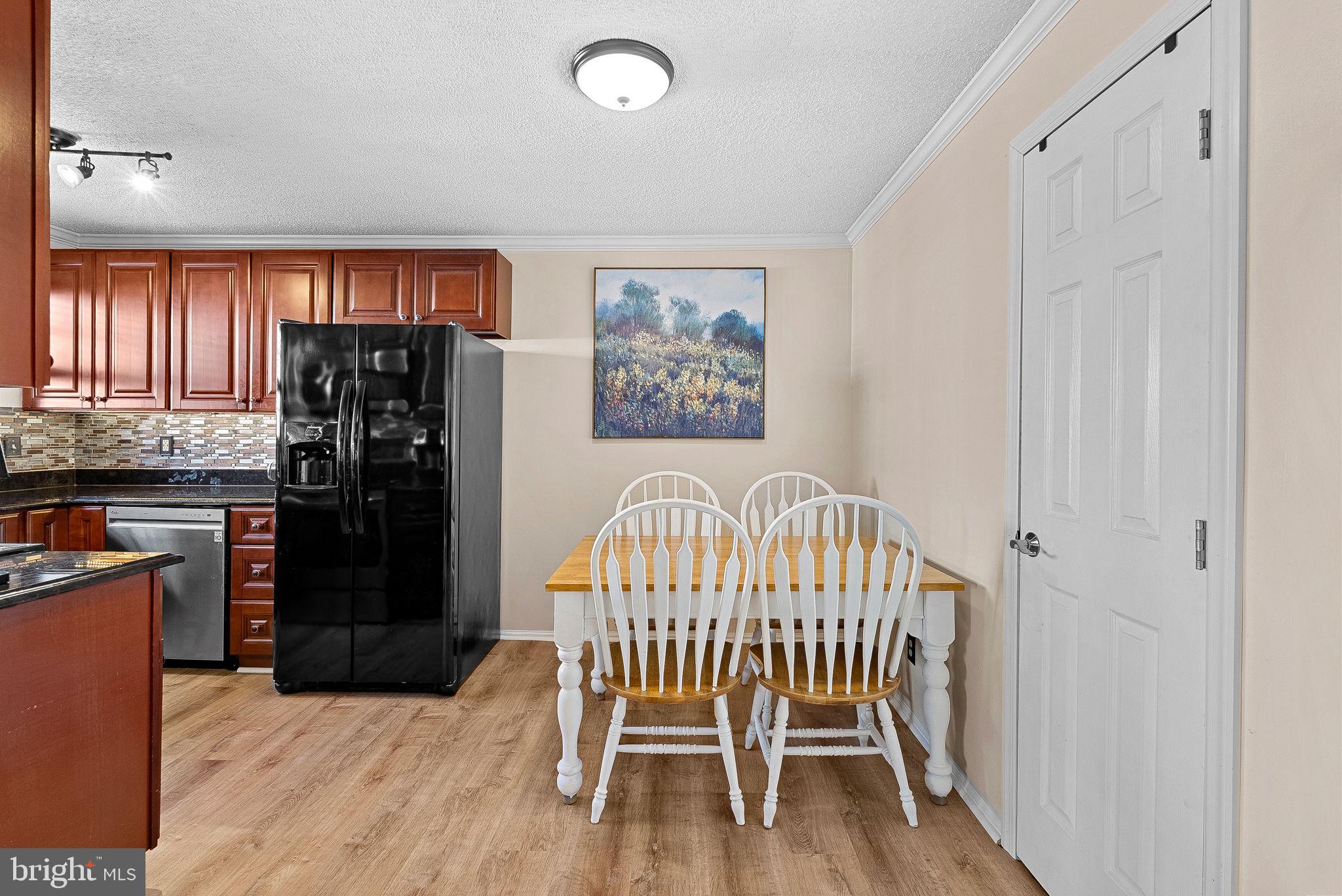 1115 Huntmaster Terrace Northeast, Unit 202 Leesburg, VA 20176 - Photo 19 of 33 Open kitchen into dining area.