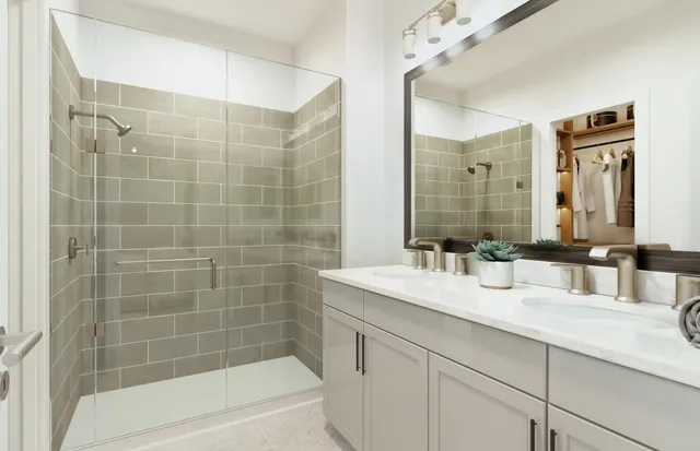 a bathroom with a granite countertop sink a mirror a bathtub and shower