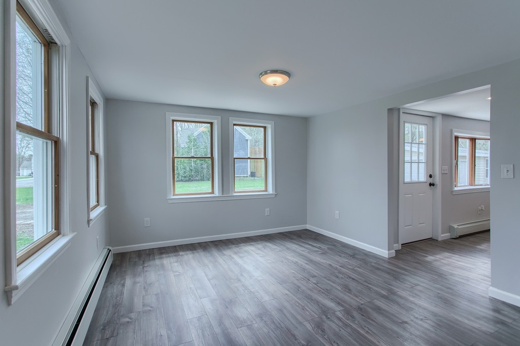 18 South Martin Road Amesbury, MA 01913 - Photo 11 of 30 a view of livingroom with hardwood floor and window