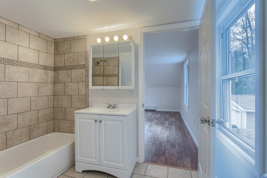 18 South Martin Road Amesbury, MA 01913 - Photo 19 of 30 a bathroom with a bathtub and a sink