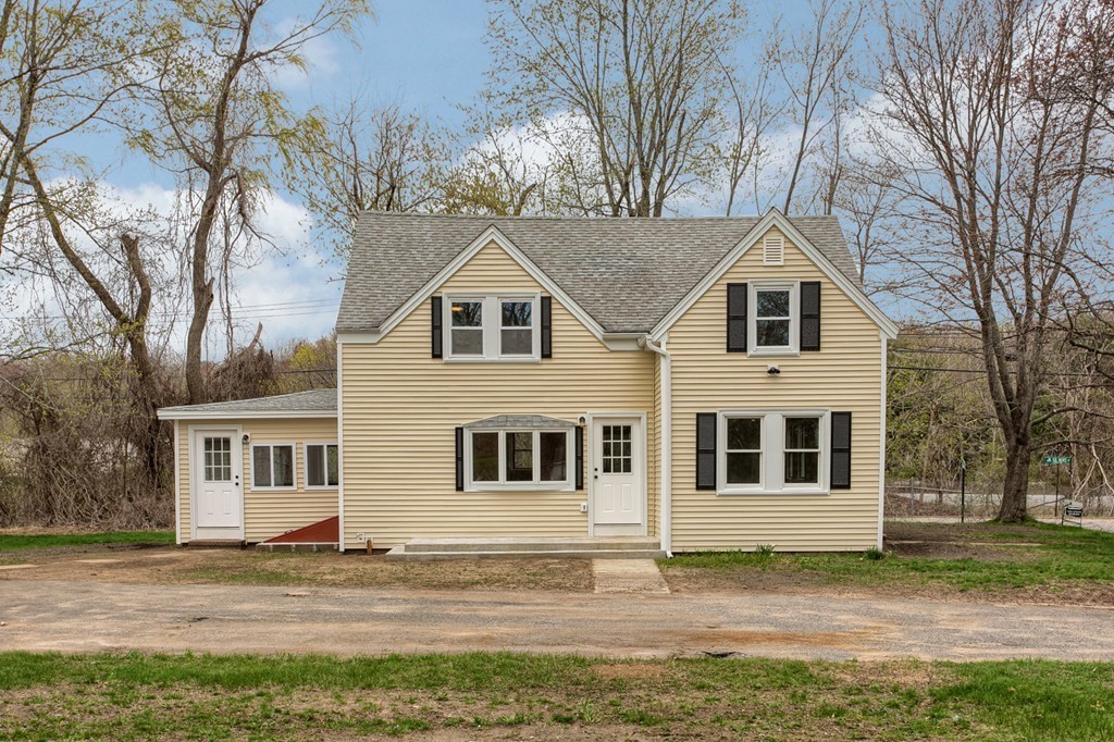18 South Martin Road Amesbury, MA 01913 - Photo 2 of 30 a house that has a tree in front of the house