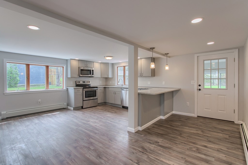 18 South Martin Road Amesbury, MA 01913 - Photo 5 of 30 a view of kitchen with wooden floor and electronic appliances