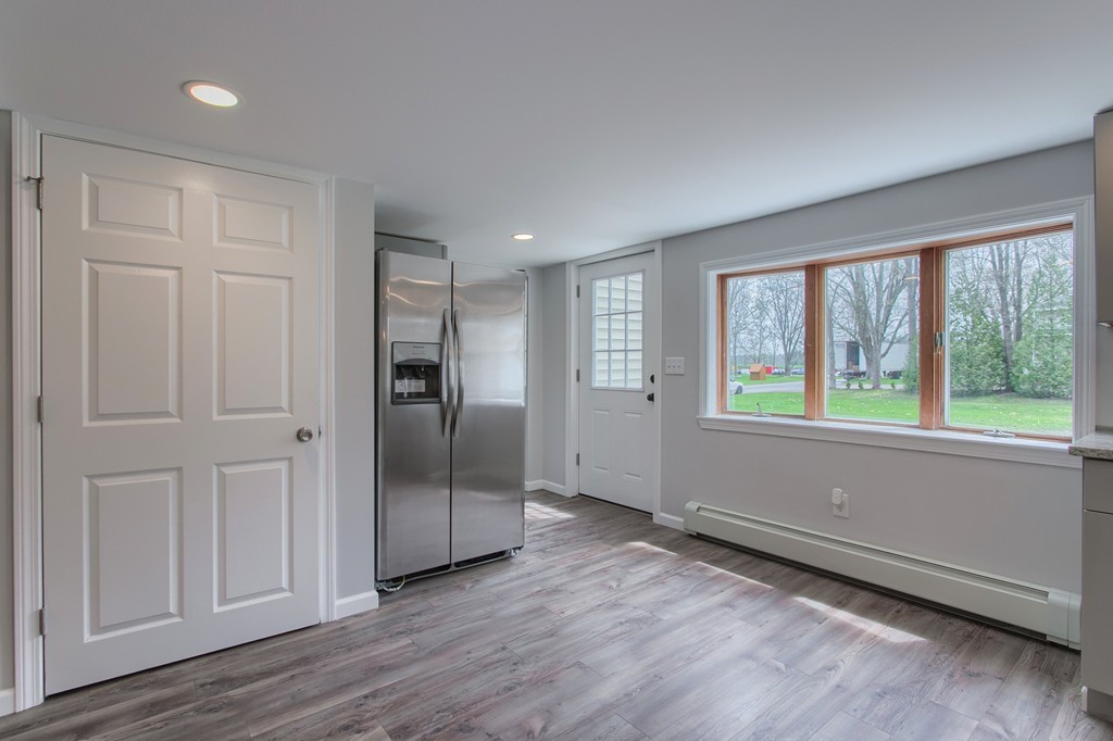 18 South Martin Road Amesbury, MA 01913 - Photo 7 of 30 a view of an empty room with wooden floor and a window