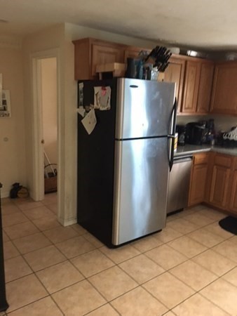 997 Middlesex Street, Unit 3 Lowell, MA 01851 - Photo 5 of 11 a kitchen with stainless steel appliances a refrigerator and a sink
