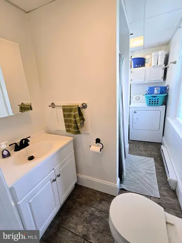 a bathroom with a bathtub sink and toilet