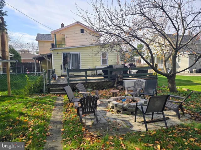 a view of a patio with table and chairs and potted plants