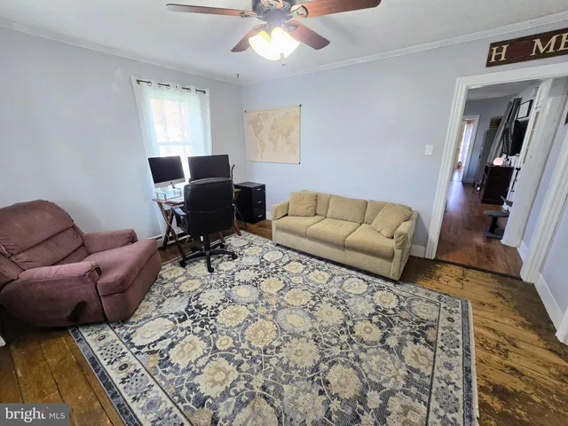 a living room with furniture and a rug
