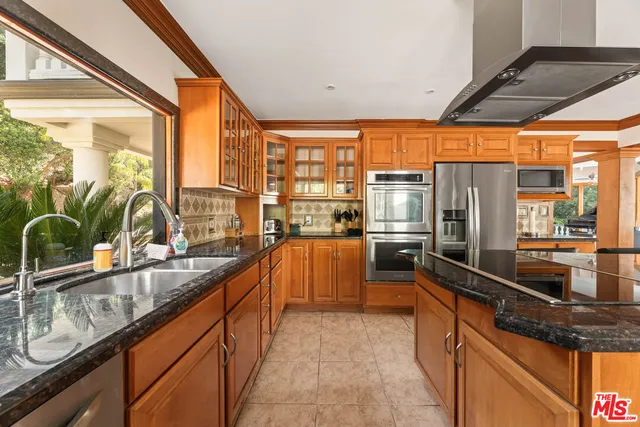 a bedroom with a bed window and a table