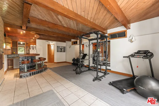 a bathroom with a double vanity sink and a large mirror
