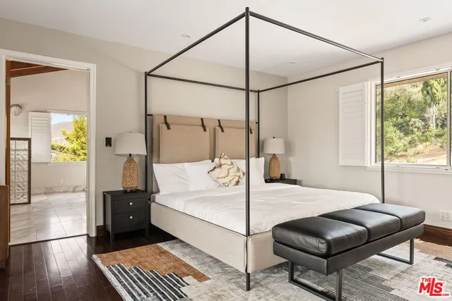 a view of a dining room with furniture and windows