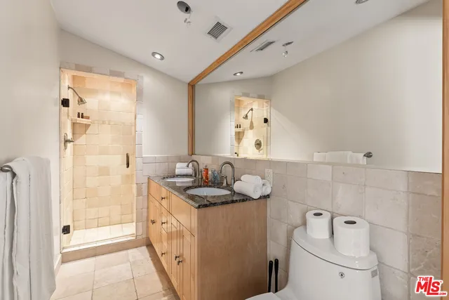 a bedroom with a large bed and a large window