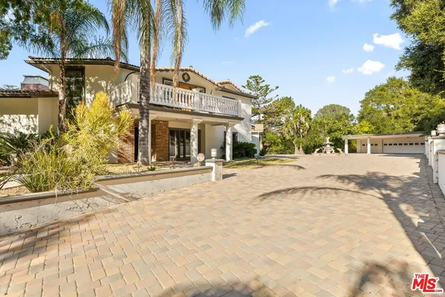 a living room with fireplace furniture and a flat screen tv