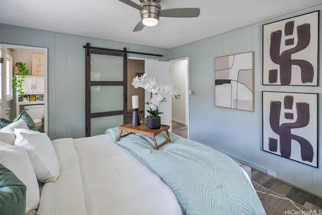 a bedroom with a bed and a chandelier