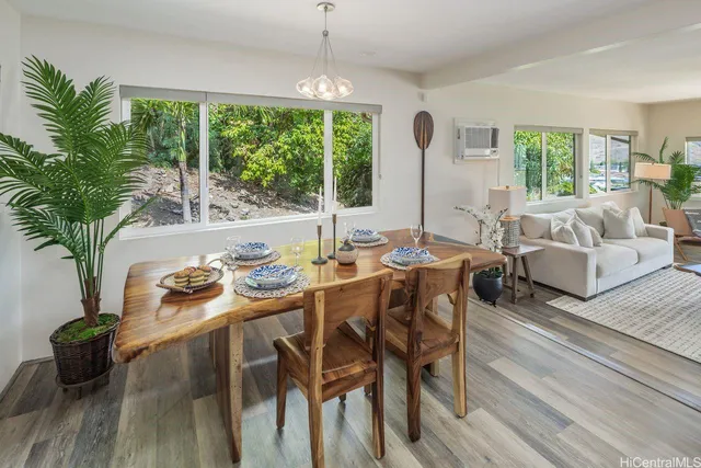 a living room with furniture and large windows