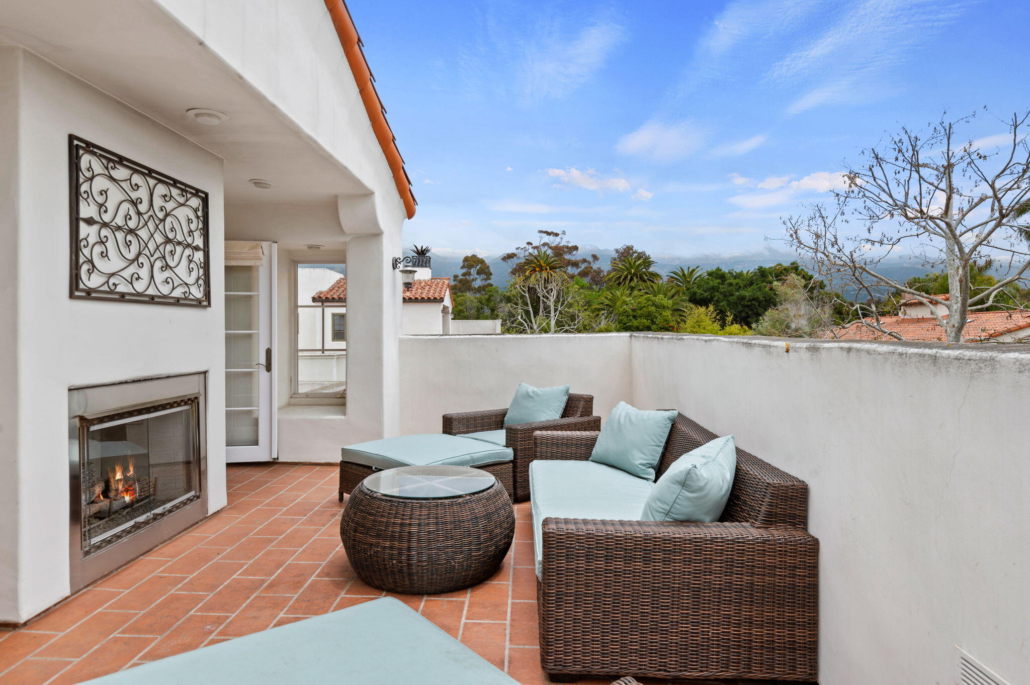 4366 Modoc Road Santa Barbara, CA 93110 - Photo 22 of 23 a living room with furniture and a fireplace
