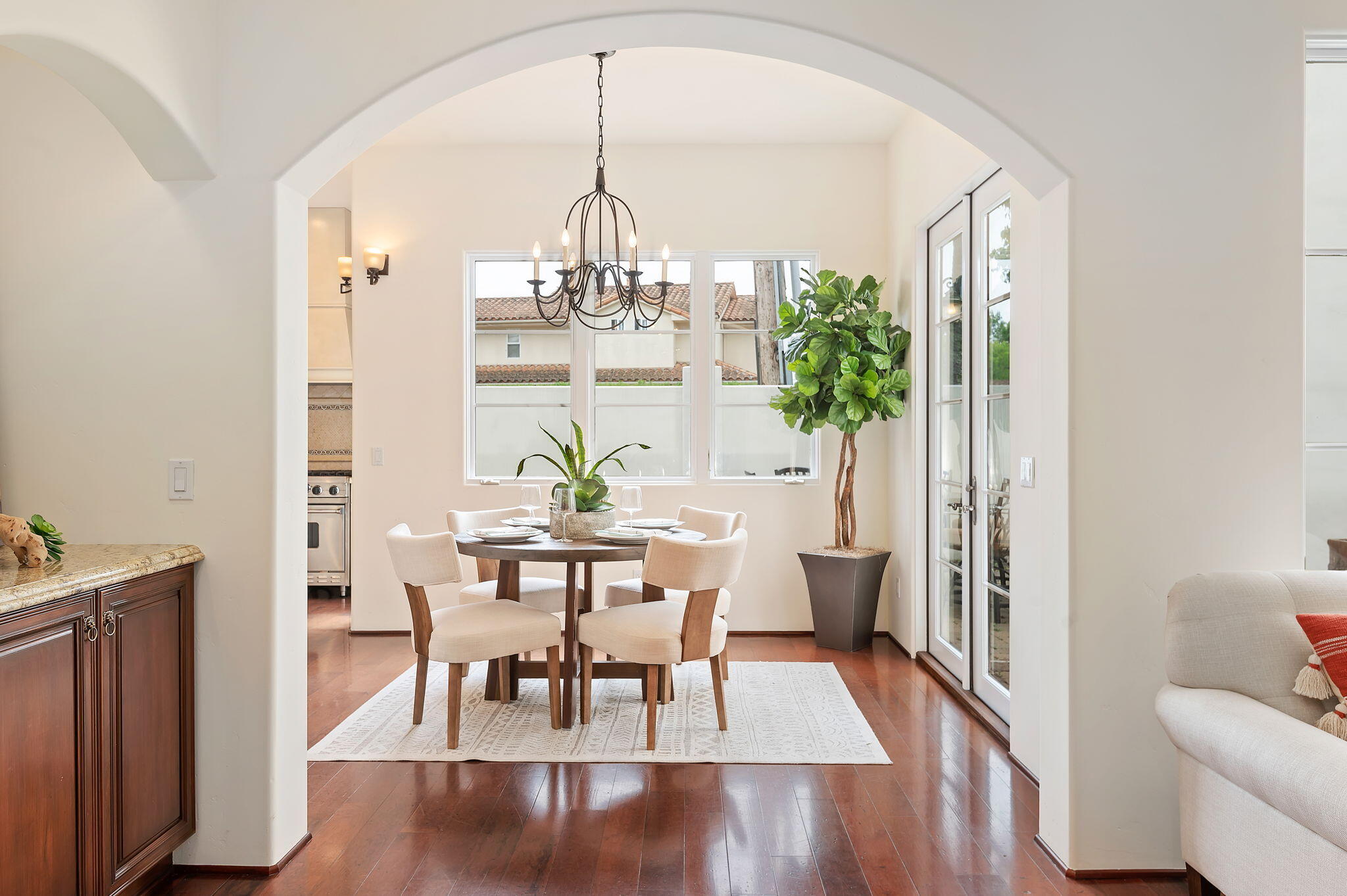 4366 Modoc Road Santa Barbara, CA 93110 - Photo 6 of 23 a view of a dining room with furniture wooden floor and chandelier