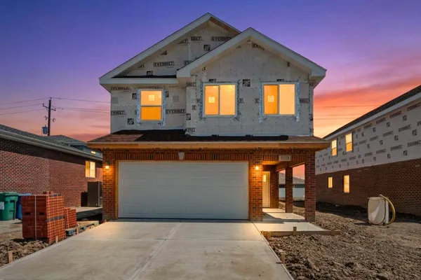 a front view of a house with patio