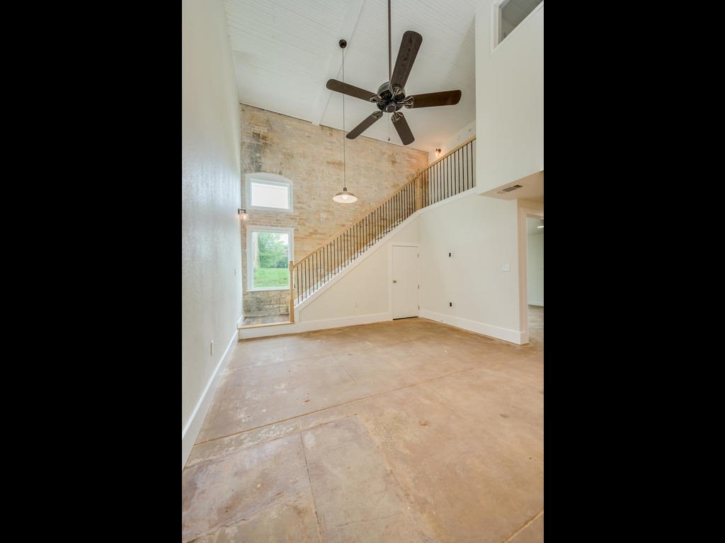 110 South Main Street, Unit 104 Elgin, TX 78621 - Photo 12 of 20 a view of a hallway with a ceiling fan