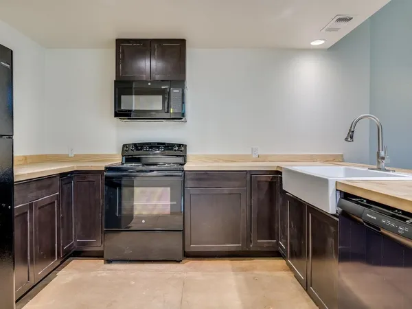 a kitchen with a stove and a sink