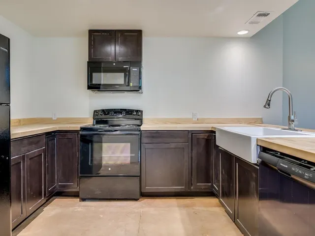 a kitchen with a stove and a sink