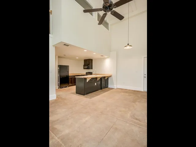 a view of a kitchen with a sink and a stove top oven