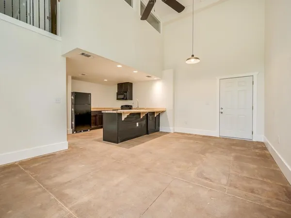 a large kitchen with cabinets and stainless steel appliances