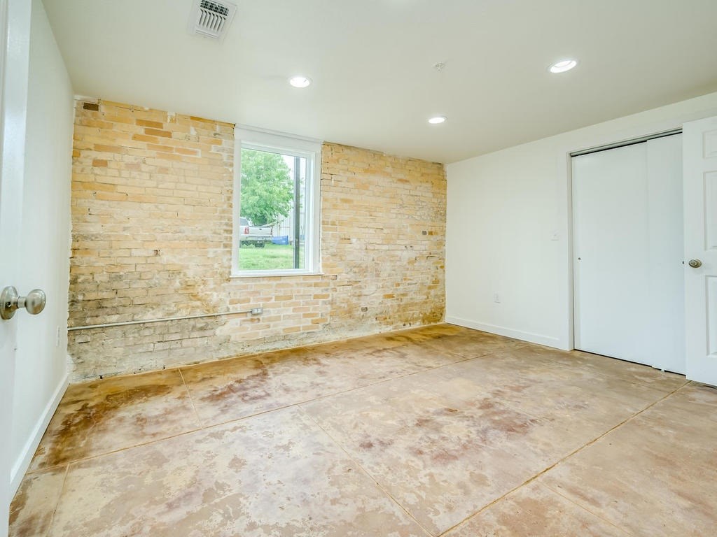 110 South Main Street, Unit 104 Elgin, TX 78621 - Photo 9 of 20 a view of an empty room with a window