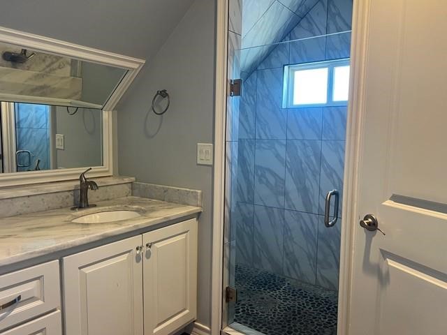 5375 County Road 73A, Unit 2 Robstown, TX 78380 - Photo 13 of 14 a bathroom with a granite countertop sink a mirror and shower