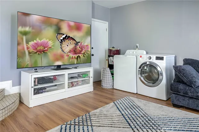 a view of a living room with washer and dryer