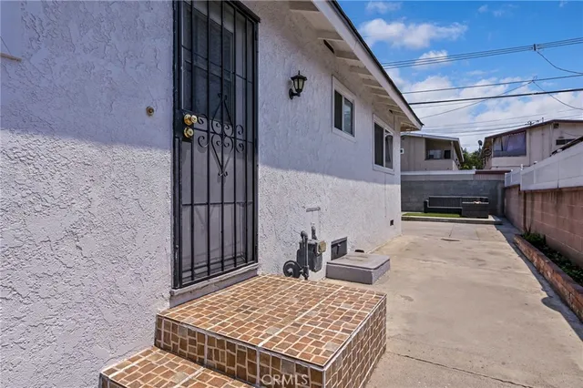 a view of a backyard with sitting area
