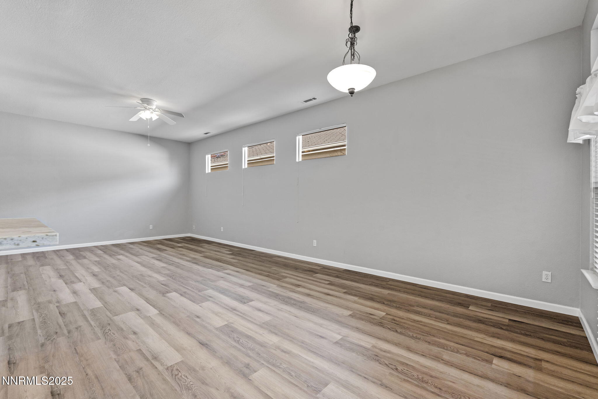 412 Sierra Leaf Circle Reno, NV 89511 - Photo 11 of 36 a view of empty room with wooden floor