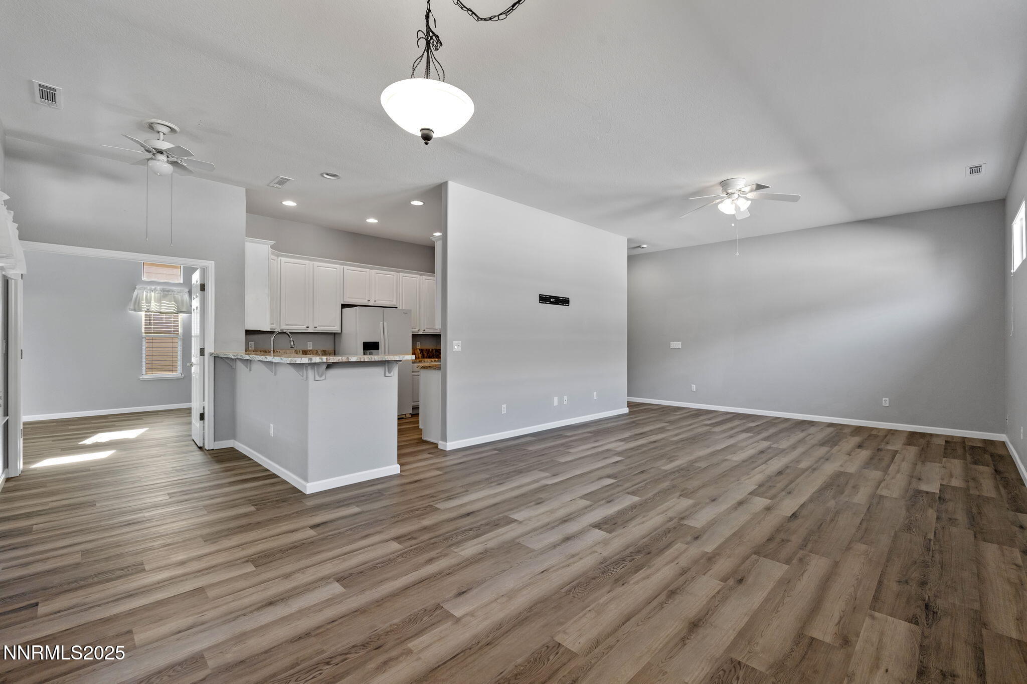 412 Sierra Leaf Circle Reno, NV 89511 - Photo 14 of 36 a view of kitchen cabinet and wooden floor