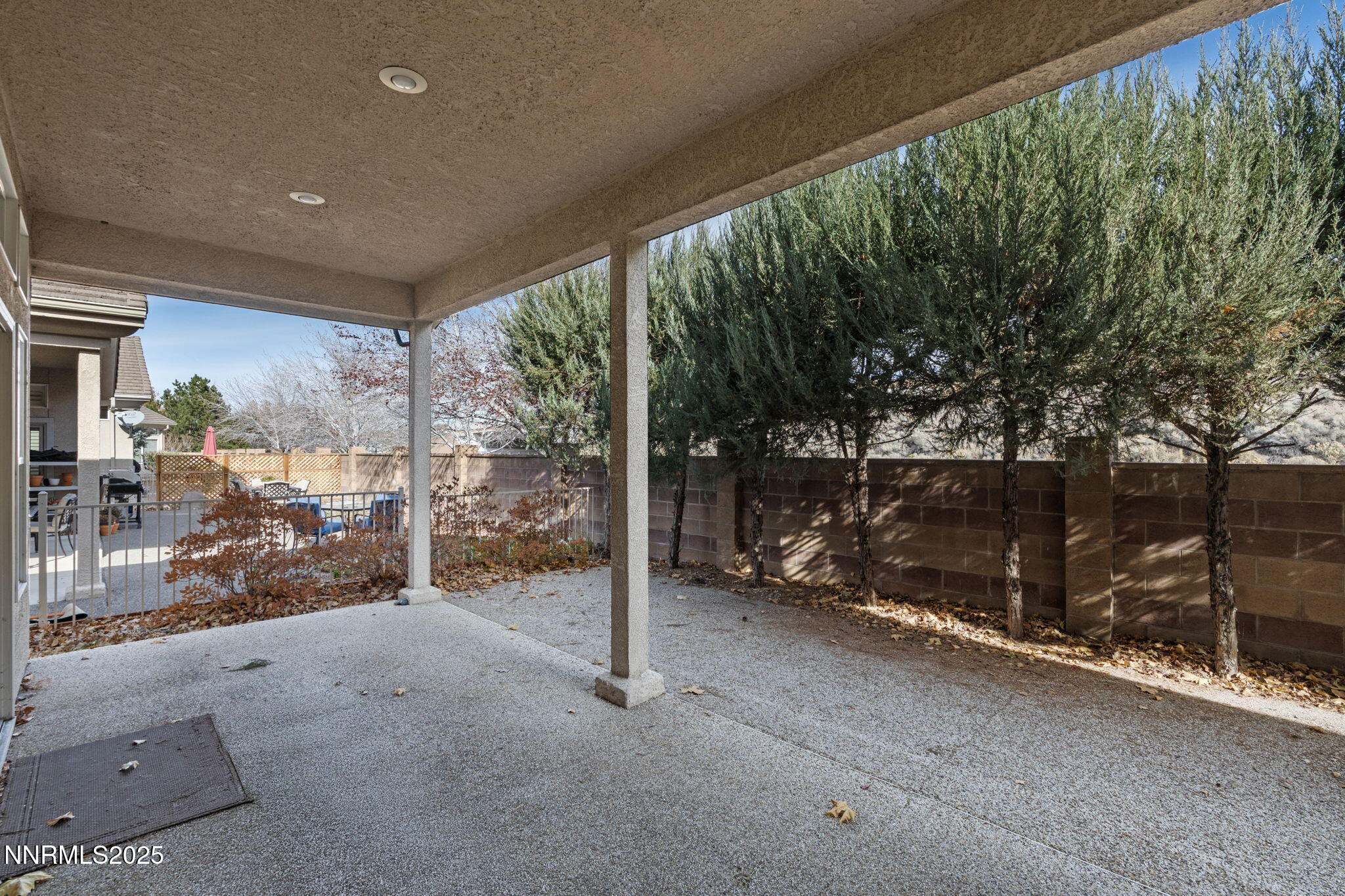412 Sierra Leaf Circle Reno, NV 89511 - Photo 32 of 36 a view of an empty room with wooden floor and iron stairs