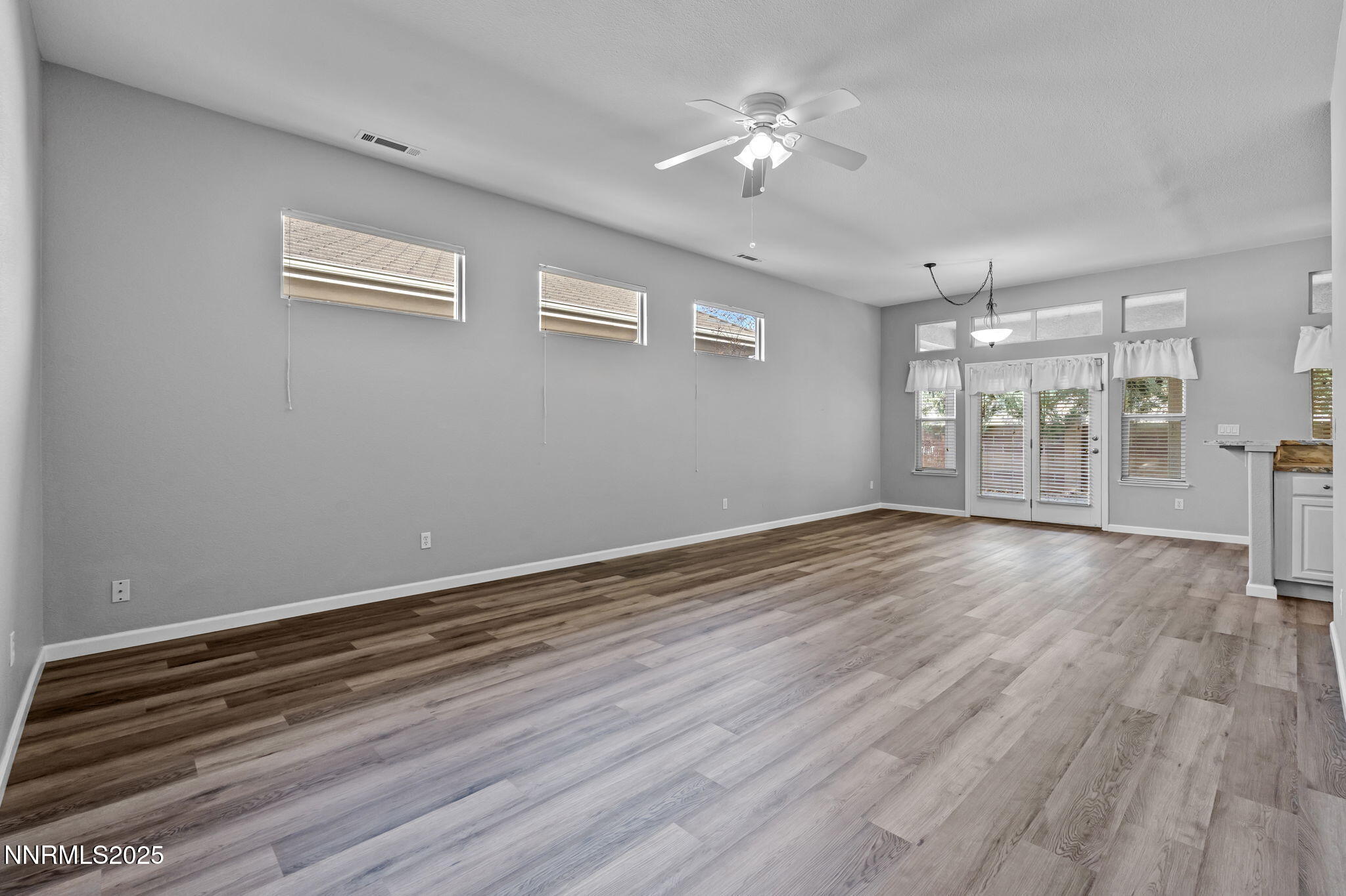412 Sierra Leaf Circle Reno, NV 89511 - Photo 7 of 36 a view of an empty room with a window