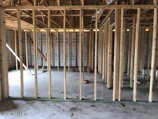 a view of a door with wooden fence