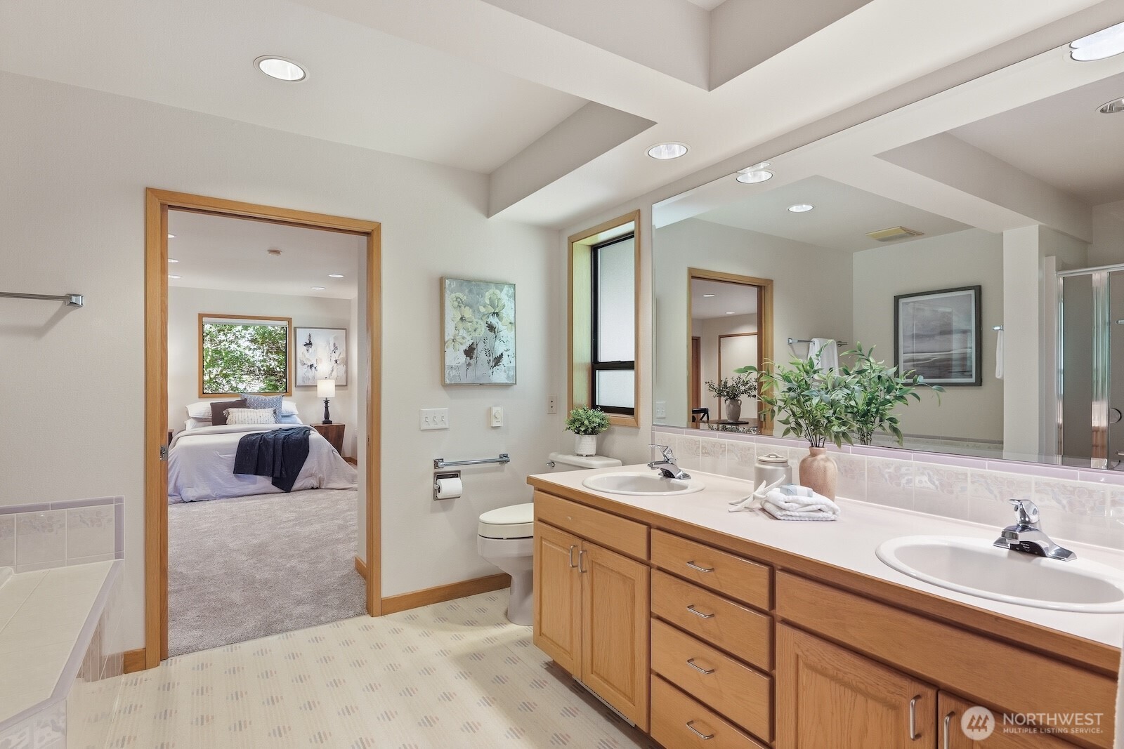 30130 Southeast Issaquah-Fall City Road Fall City, WA 98024 - Photo 19 of 39 a bathroom with double vanity sinks a large mirror and a bathtub