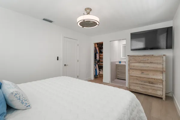 a bathroom with a shower and toilet