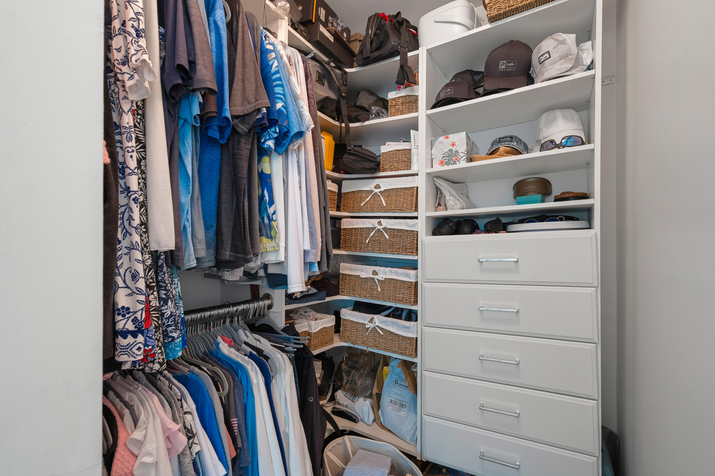 114 Spoonbill Road Tavernier, FL 33070 - Photo 18 of 43 a view of walk in closet with clothes and shoes