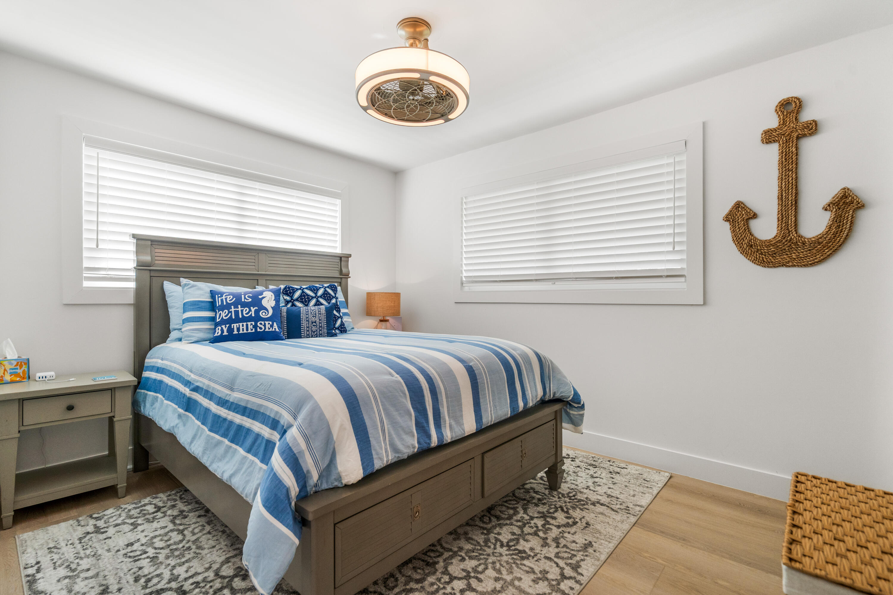 114 Spoonbill Road Tavernier, FL 33070 - Photo 19 of 43 a bed sitting in a bedroom next to a window