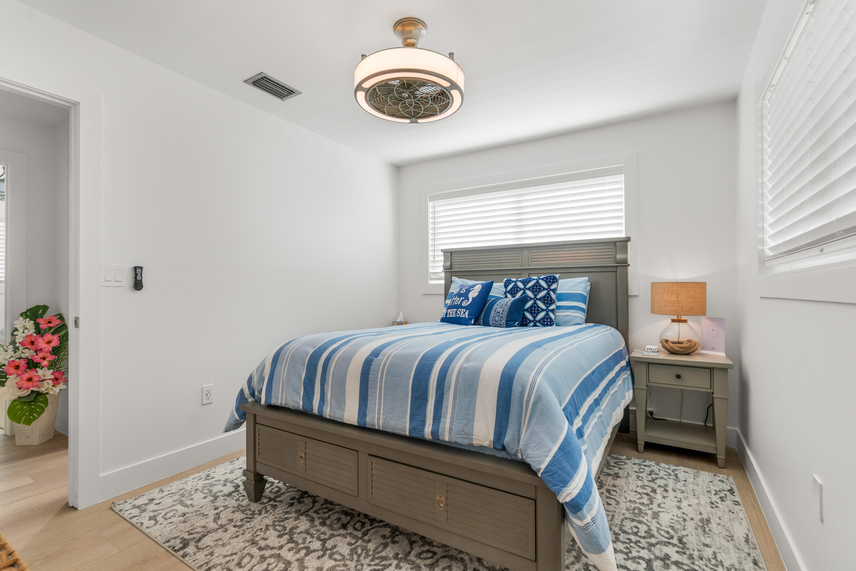 114 Spoonbill Road Tavernier, FL 33070 - Photo 20 of 43 a bedroom with a bed and a window