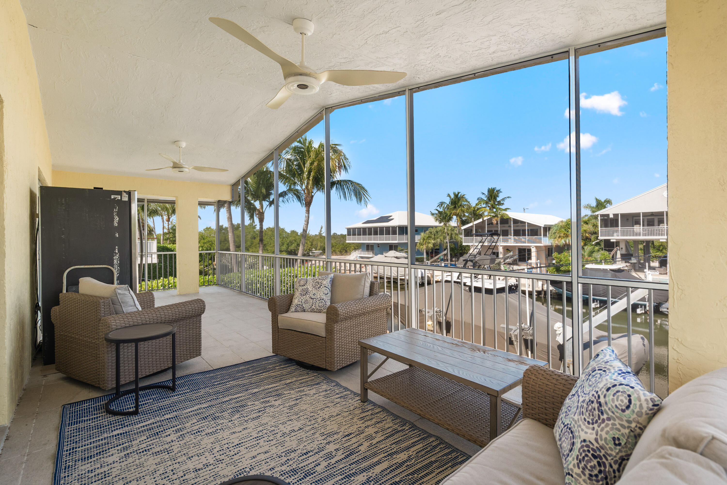 114 Spoonbill Road Tavernier, FL 33070 - Photo 25 of 43 a living room with furniture and a large window