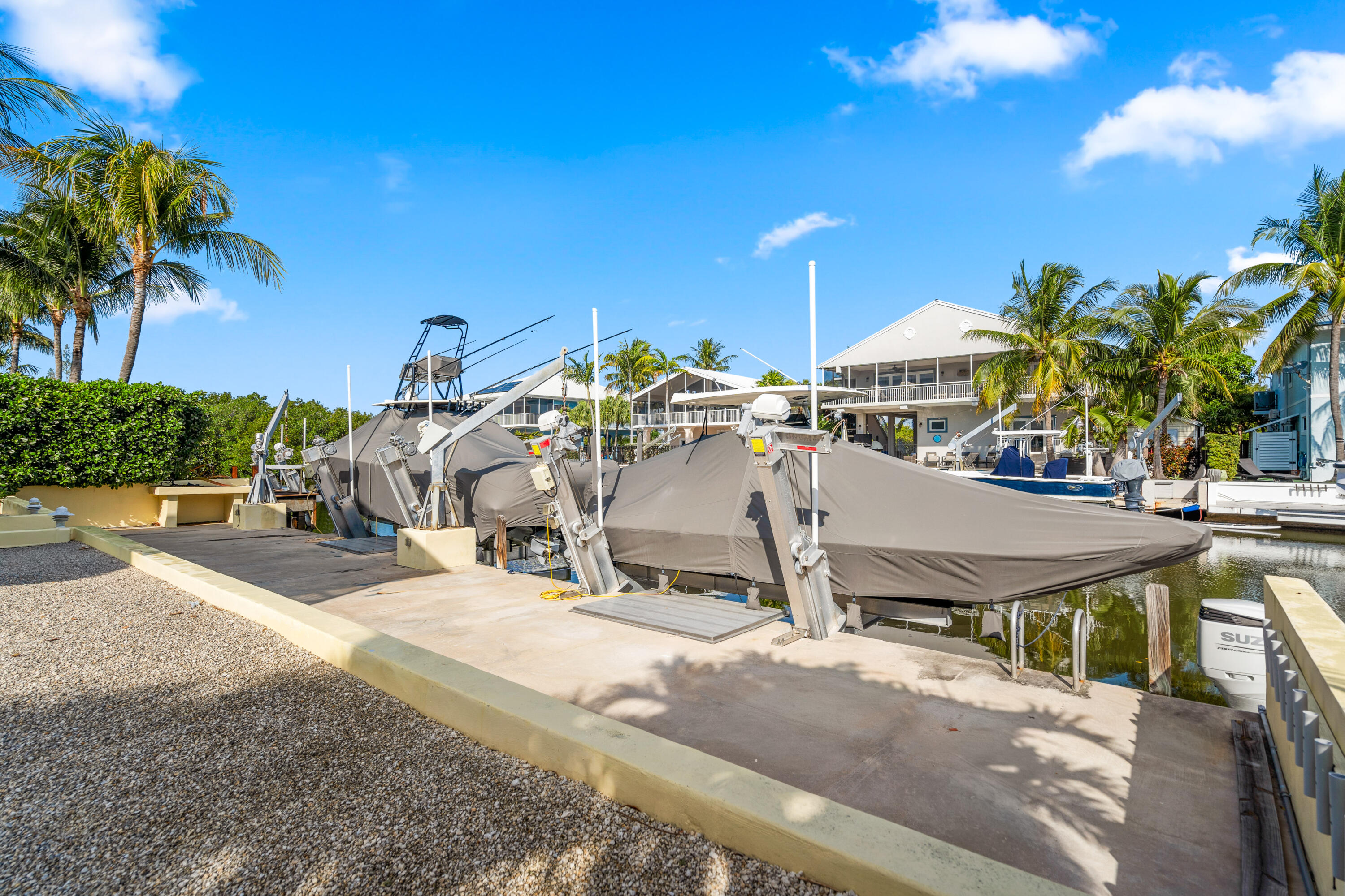 114 Spoonbill Road Tavernier, FL 33070 - Photo 28 of 43 a view of a swimming pool and lounge chairs
