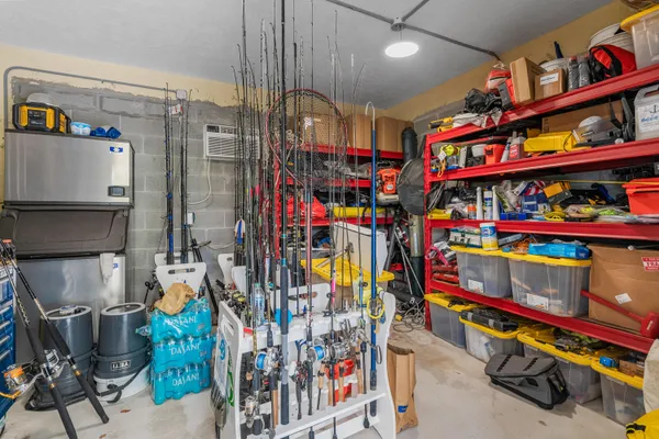 an aerial view of a house with a garden and lake view