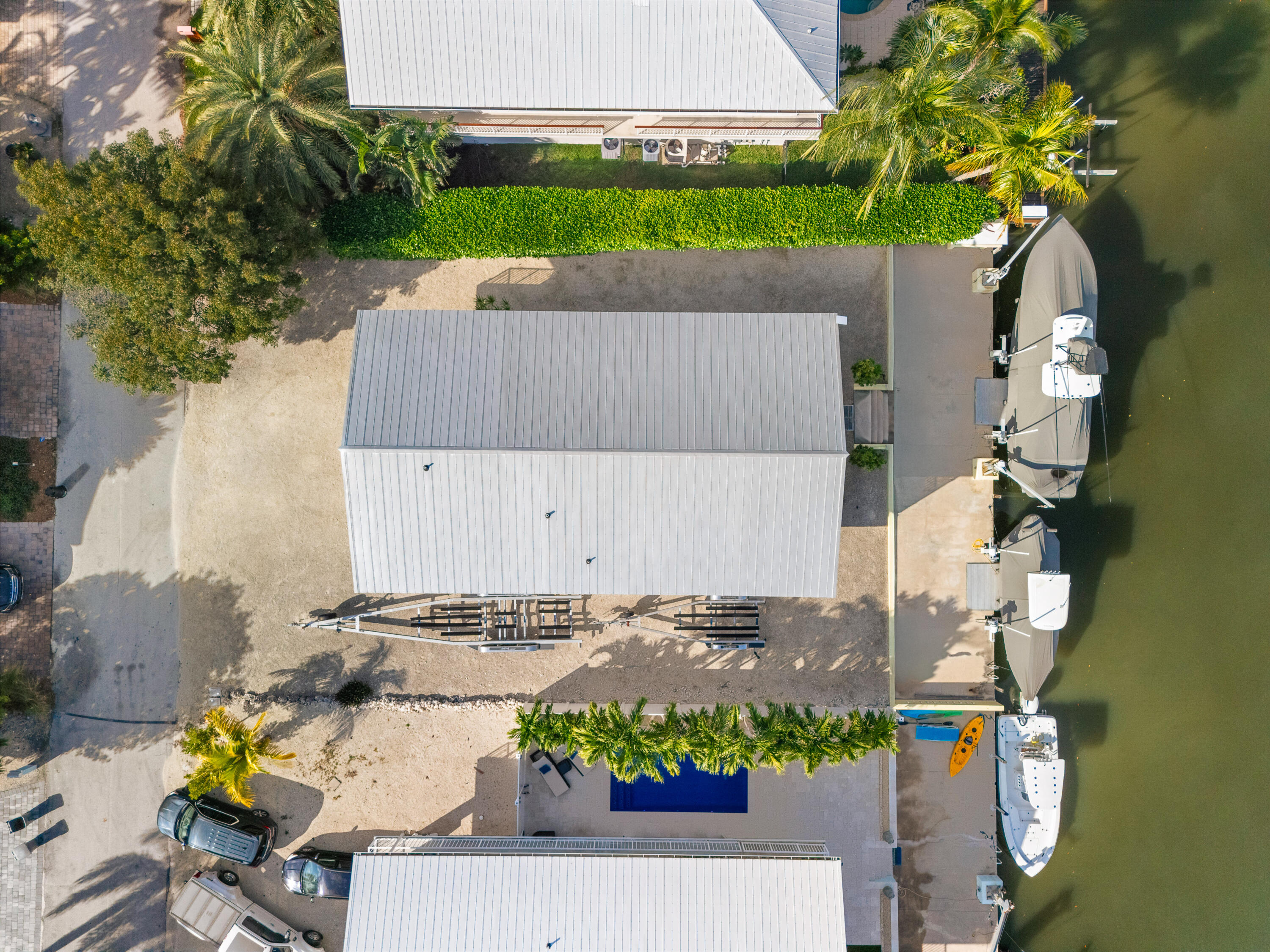 114 Spoonbill Road Tavernier, FL 33070 - Photo 42 of 43 an aerial view of a house with a yard and a large tree
